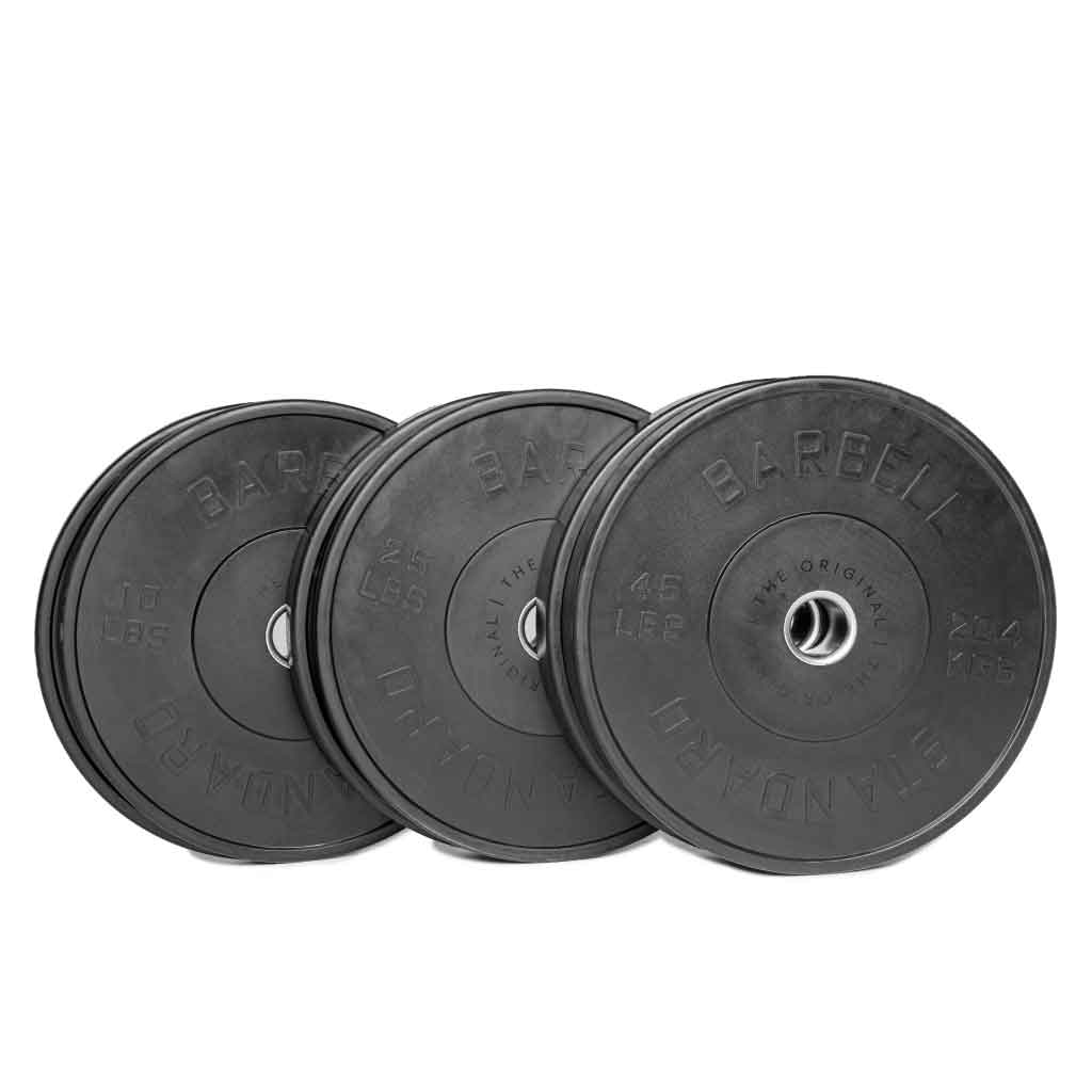A set of black Olympic bumper plates with raised lettering and the Barbell Standard logo on the center.