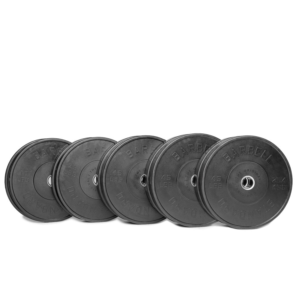 A set of black Olympic bumper plates with raised lettering and the Barbell Standard logo on the center.