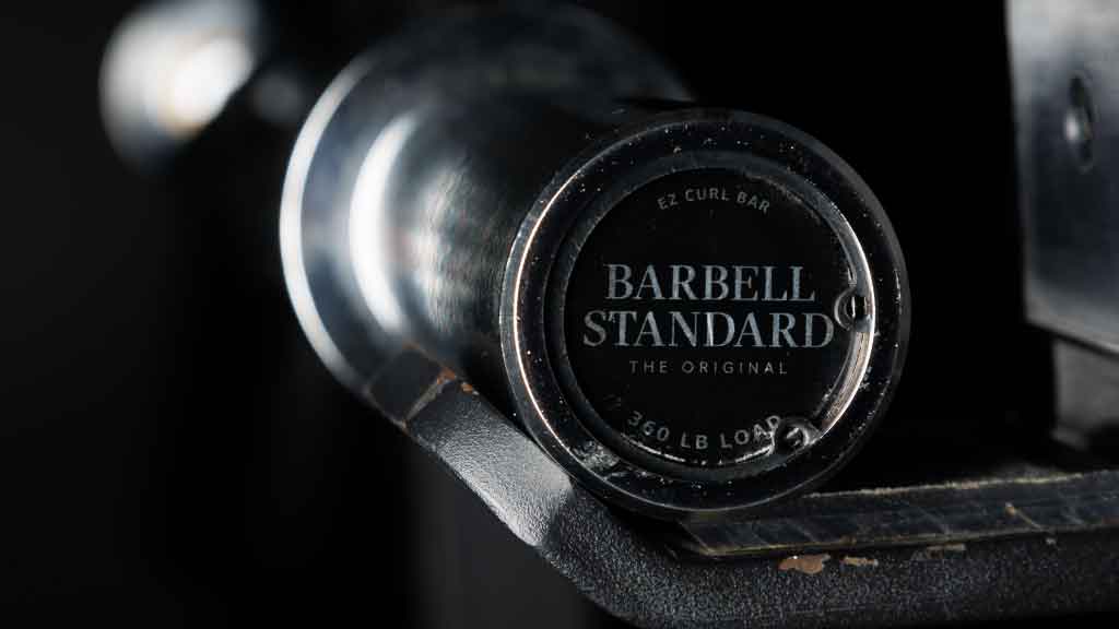 Barbell Standard EZ curl bar with chrome finish and branded end cap rated for 350 lb load capacity
