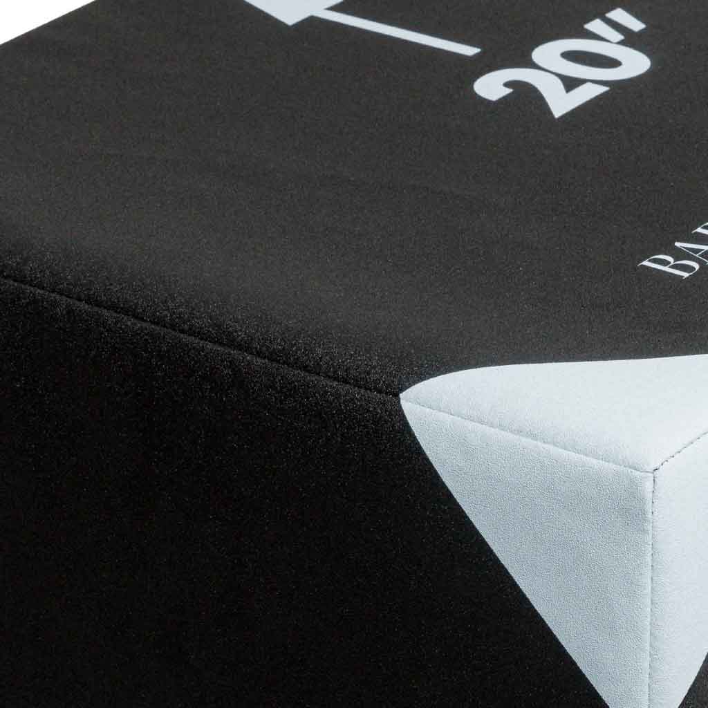 Closeup of Barbell Standard foam plyo jump box corner, showing durable stitched cover with 20-inch height marking