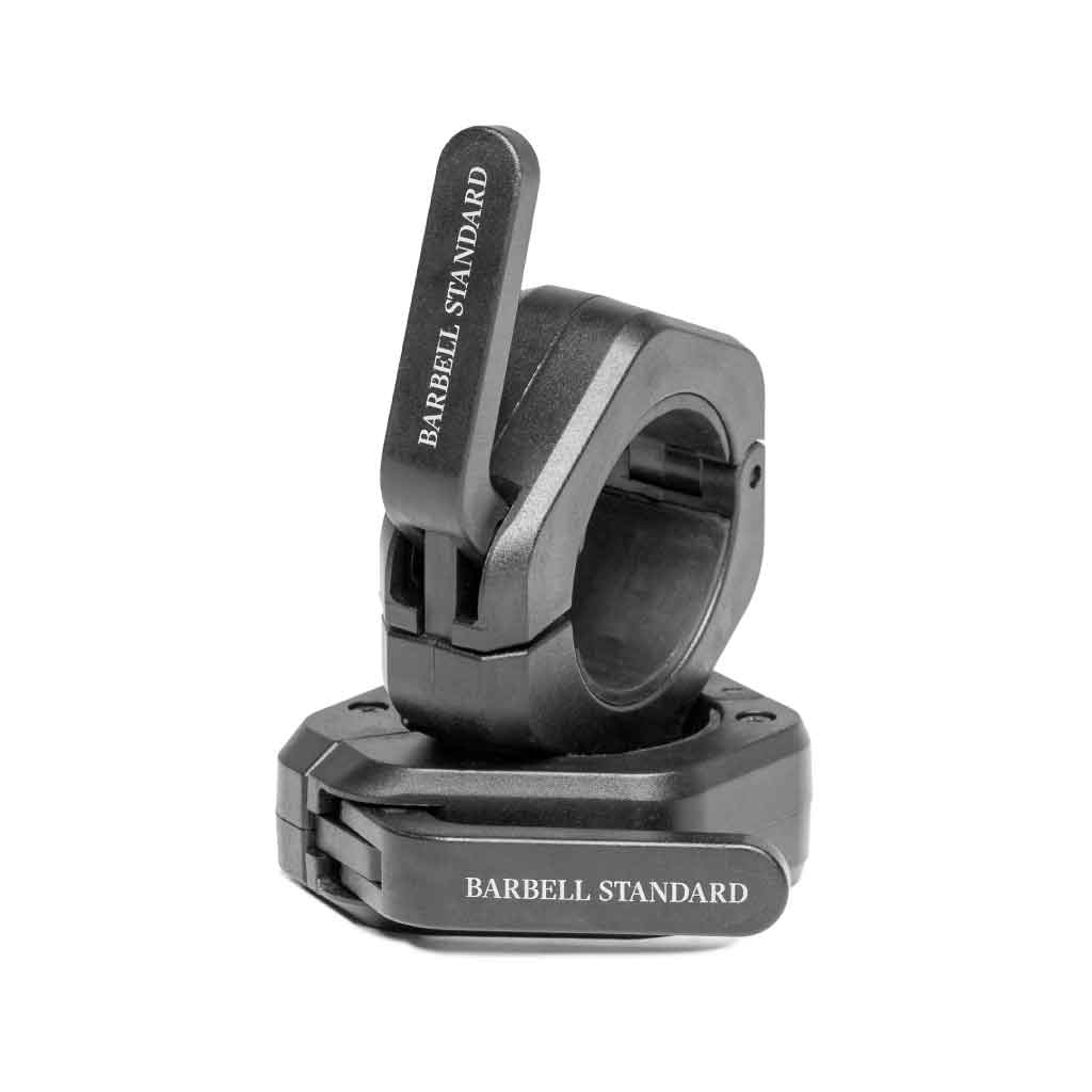 A pair of black magnetic barbell collars with the text 'BARBELL STANDARD' on the exterior surface.
