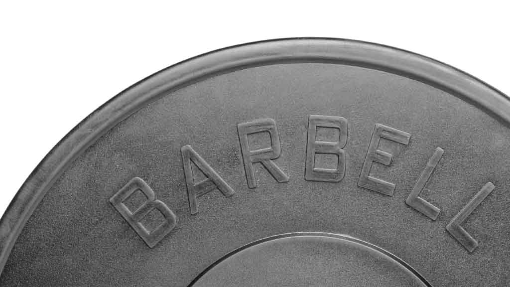 Close up of Barbell Standard bumper plate with raised text design