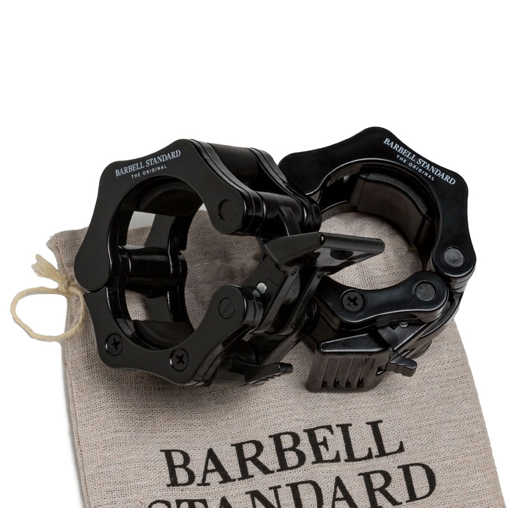 Pair of black Barbell Standard snap lock collars on branded storage bag, secure clamps for Olympic weightlifting bars