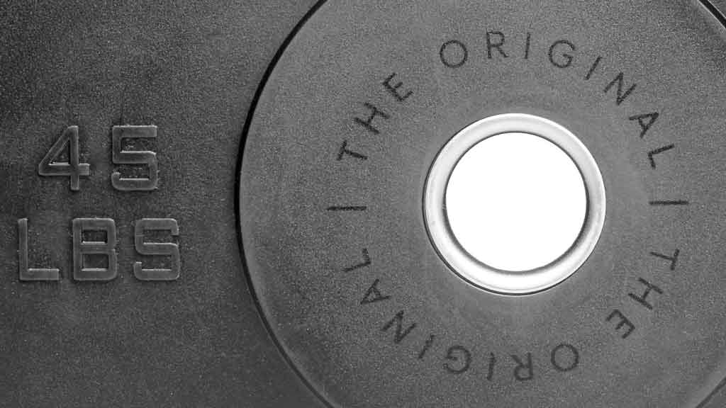 Barbell Standard 45 lb bumper plate with stainless steel insert and The Original text detail