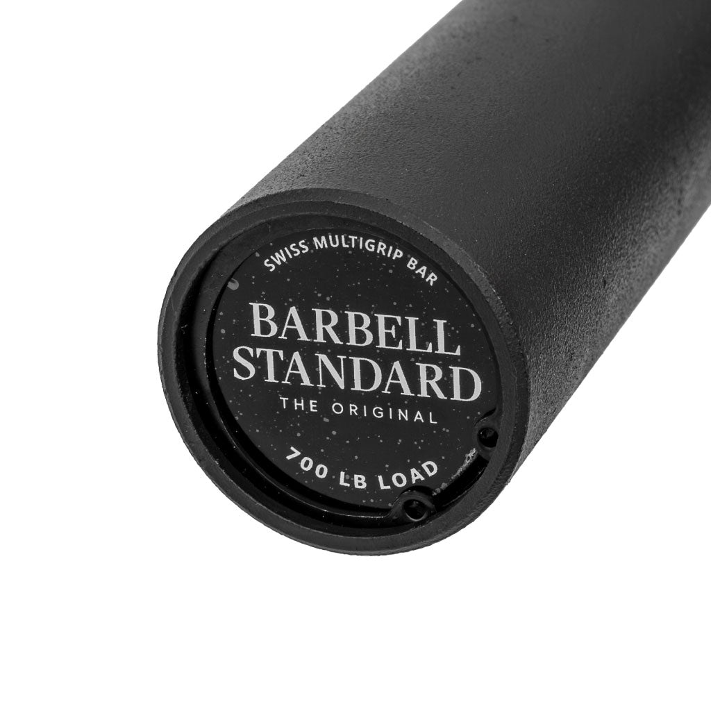 Close-up of Barbell Standard Swiss Multigrip Bar endcap with logo and 700 lb load rating