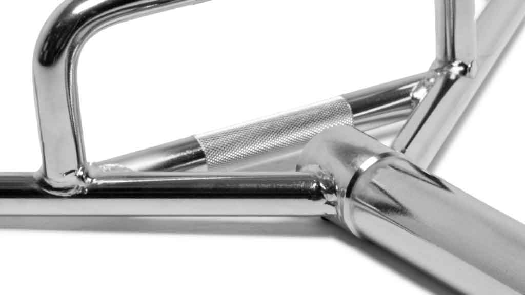 Barbell Standard trap bar close-up of knurled handle and welded chrome frame for strength training